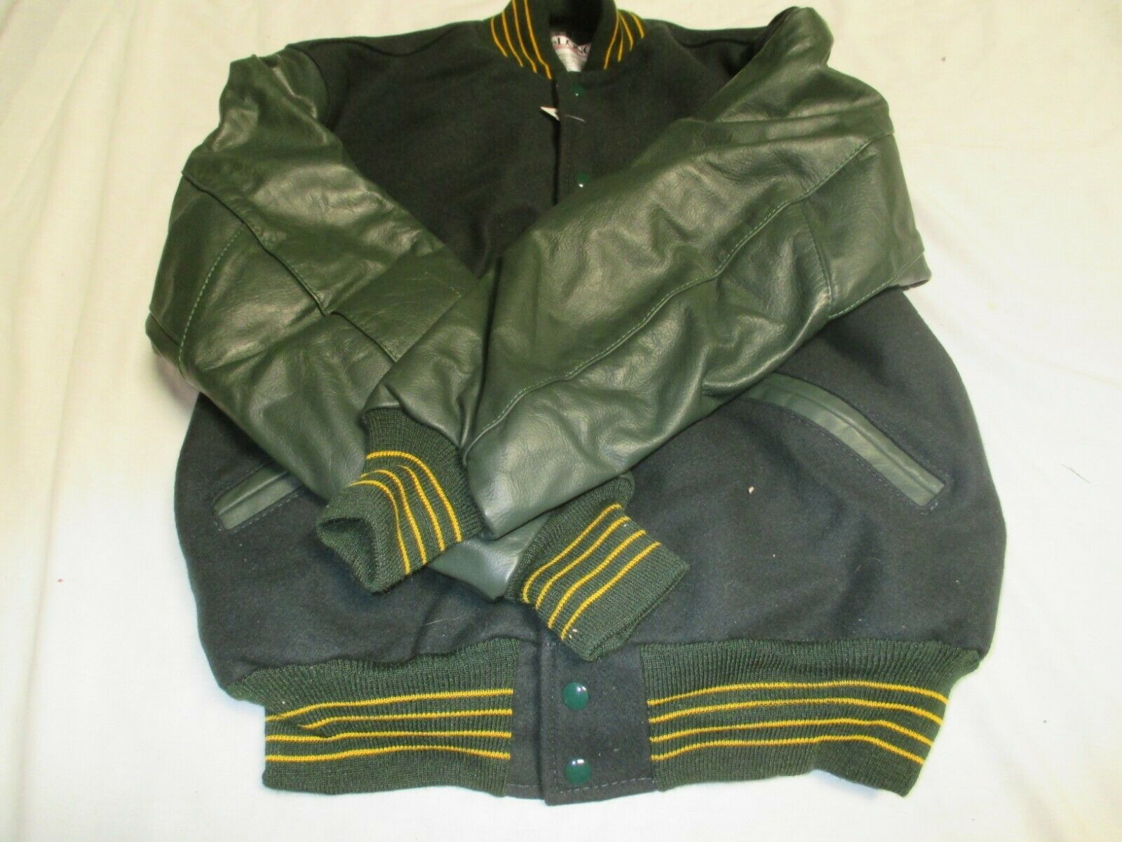 DELONG ADULT DK GRN BODY&SLEEVE QLT LINED 2 DK GR STRIPES OUTLINE IN GLD  JACKET