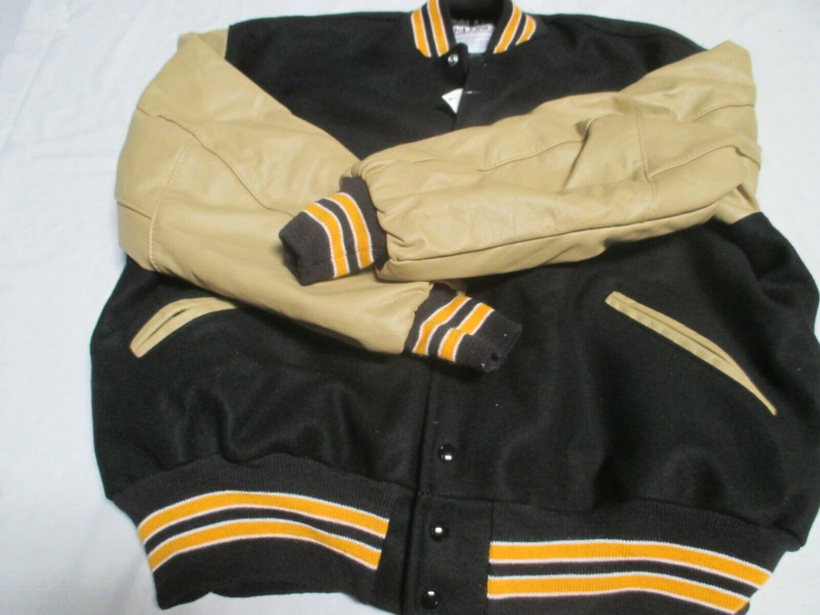 DELONG ADULT BLK W VEGAS GLD SLEEVE 2 GLD STRIPES OUTLINE IN WHT  QUILTED JACKET