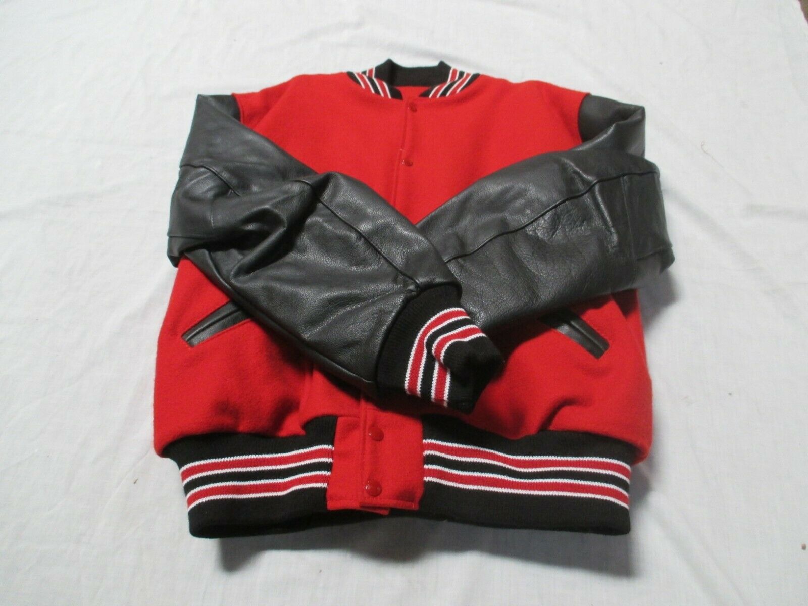 DELONG  ADULT RED/BLACK SLEEVE QUILT LINED 2 RED STRIPES OUTLINED IN WHT  JACKET