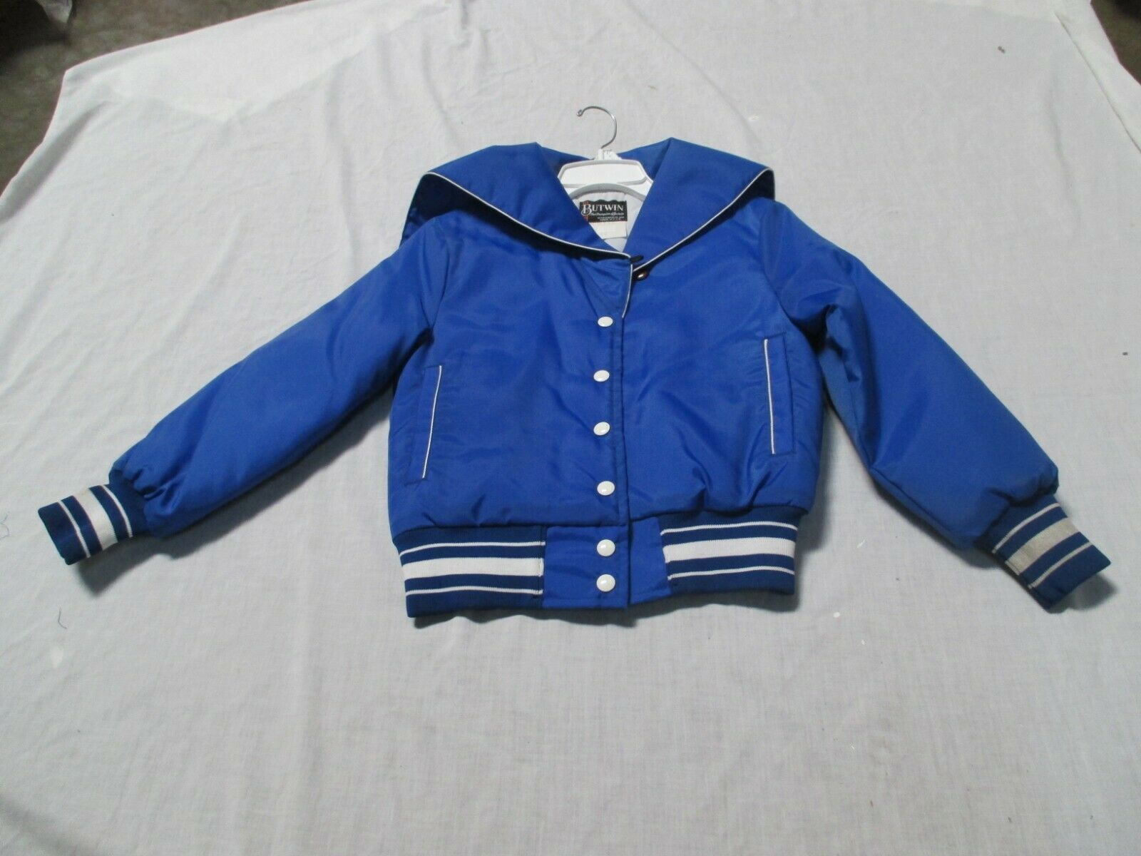 BUTWIN ADULT X-SMALL CHEERLEADER JACKET ROYAL/WHT QUILT LINED WITH  SAILOR  HOOD