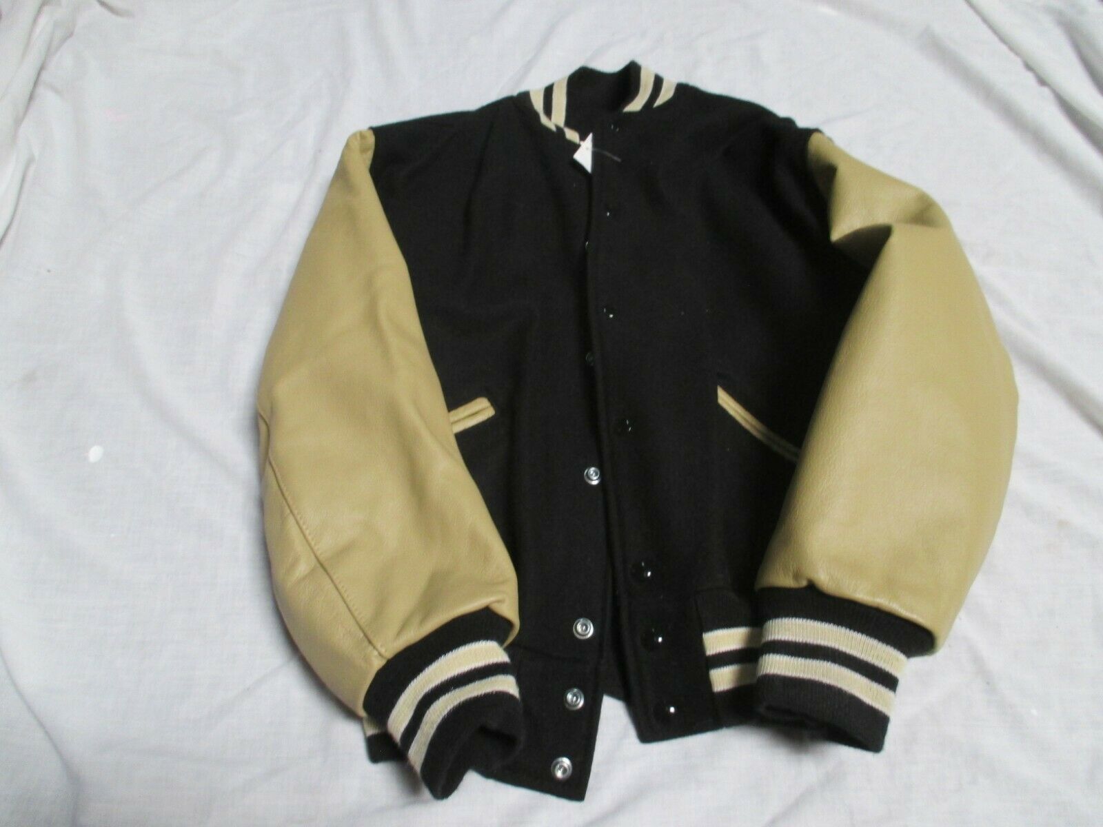 DELONG ADULT BLACK W CREAM SLEEVES 2 GLD STRIPES OUTLINE IN WHT NYL LINED JACKET