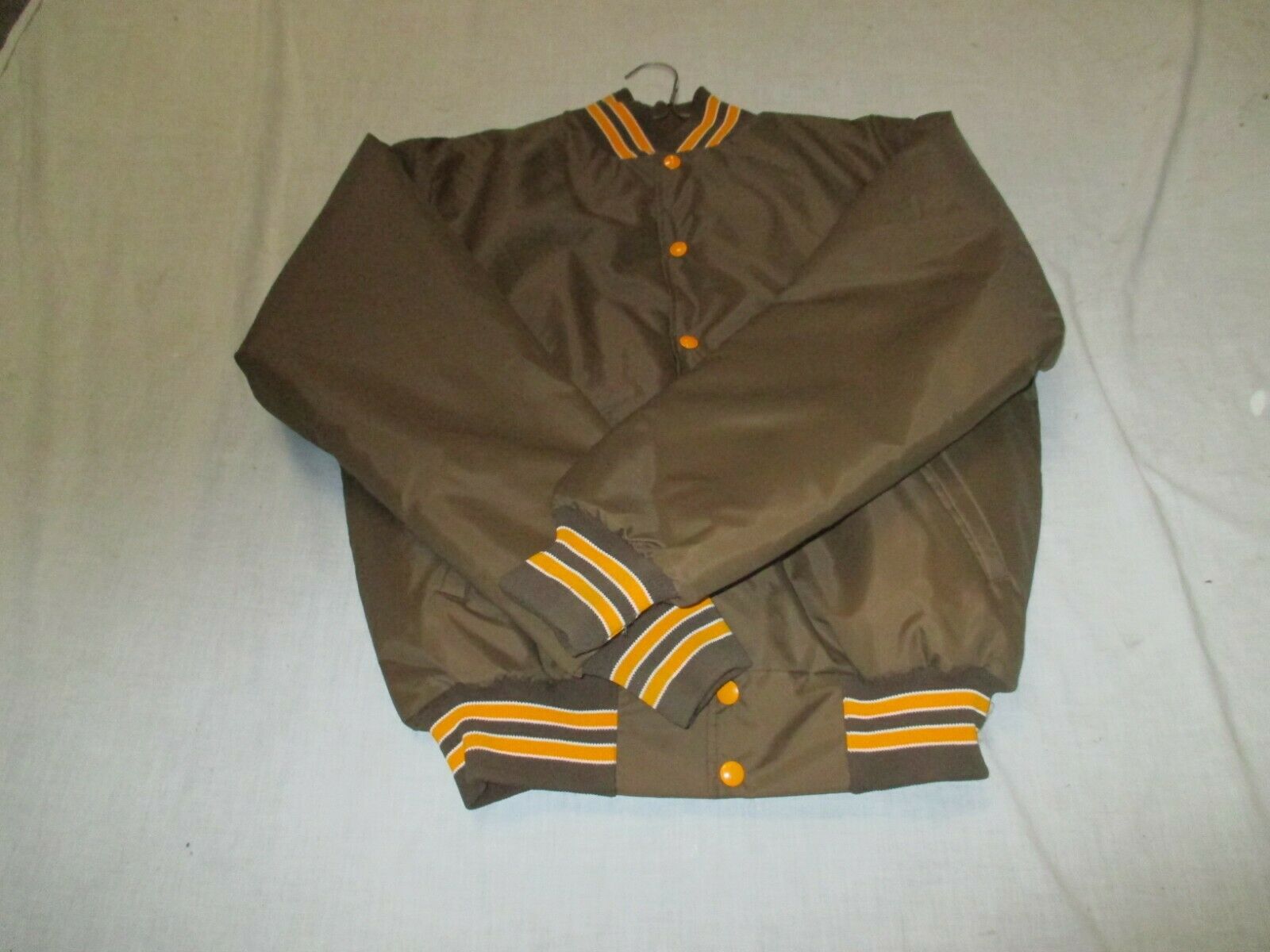 RENNOC QUILT LINED  JACKET ADULT MED  (BROWN  WITH GLD STRIPE OUTLINED IN WHT