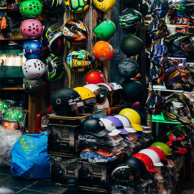 A lot of sports helmets in a store.